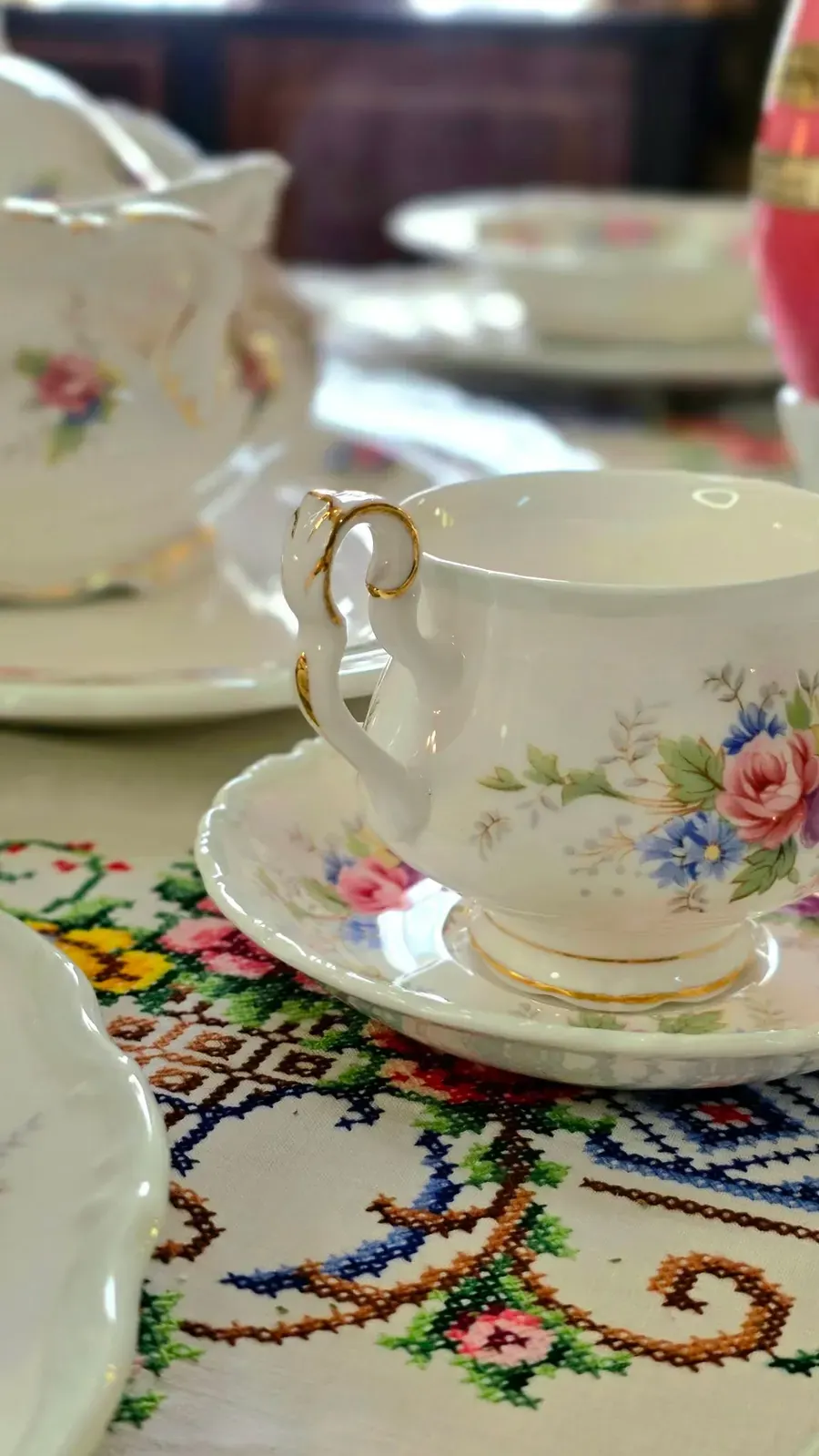 A Royal Albert cup and saucer with a gold rim