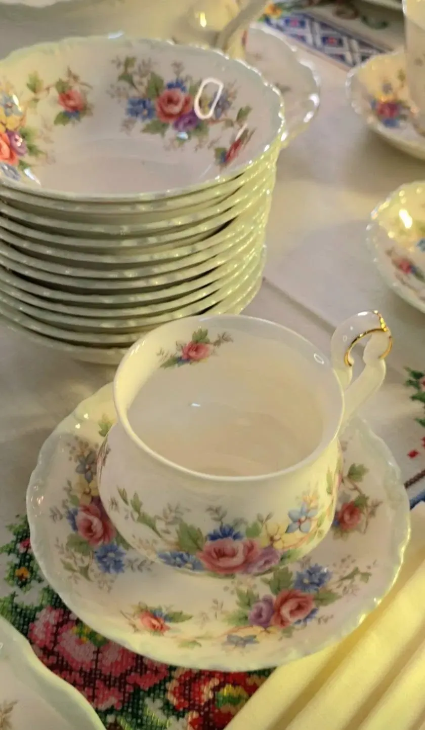 A stack of Royal Albert plates and a cup and saucer