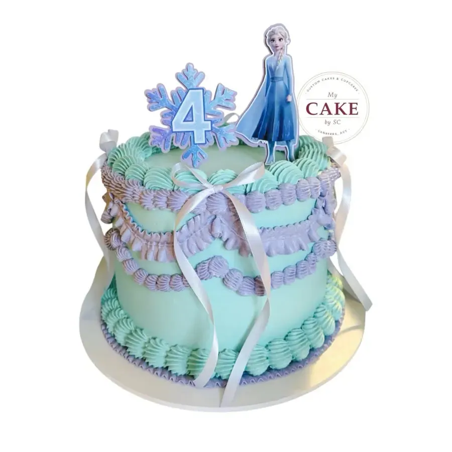 A blue and white birthday cake with butterflies