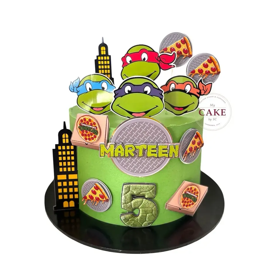 A green turtles themed cake