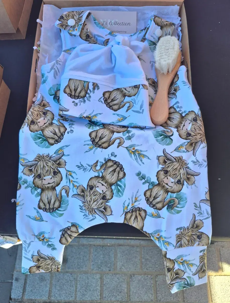 A highland cow print romper