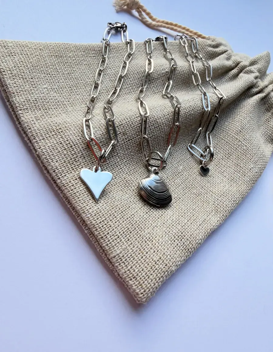 Silver necklaces with heart and shell charms