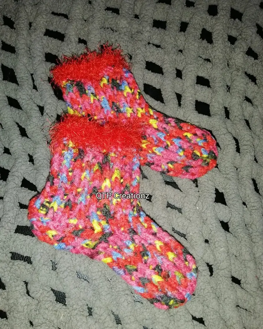 A pair of colourful crochet socks