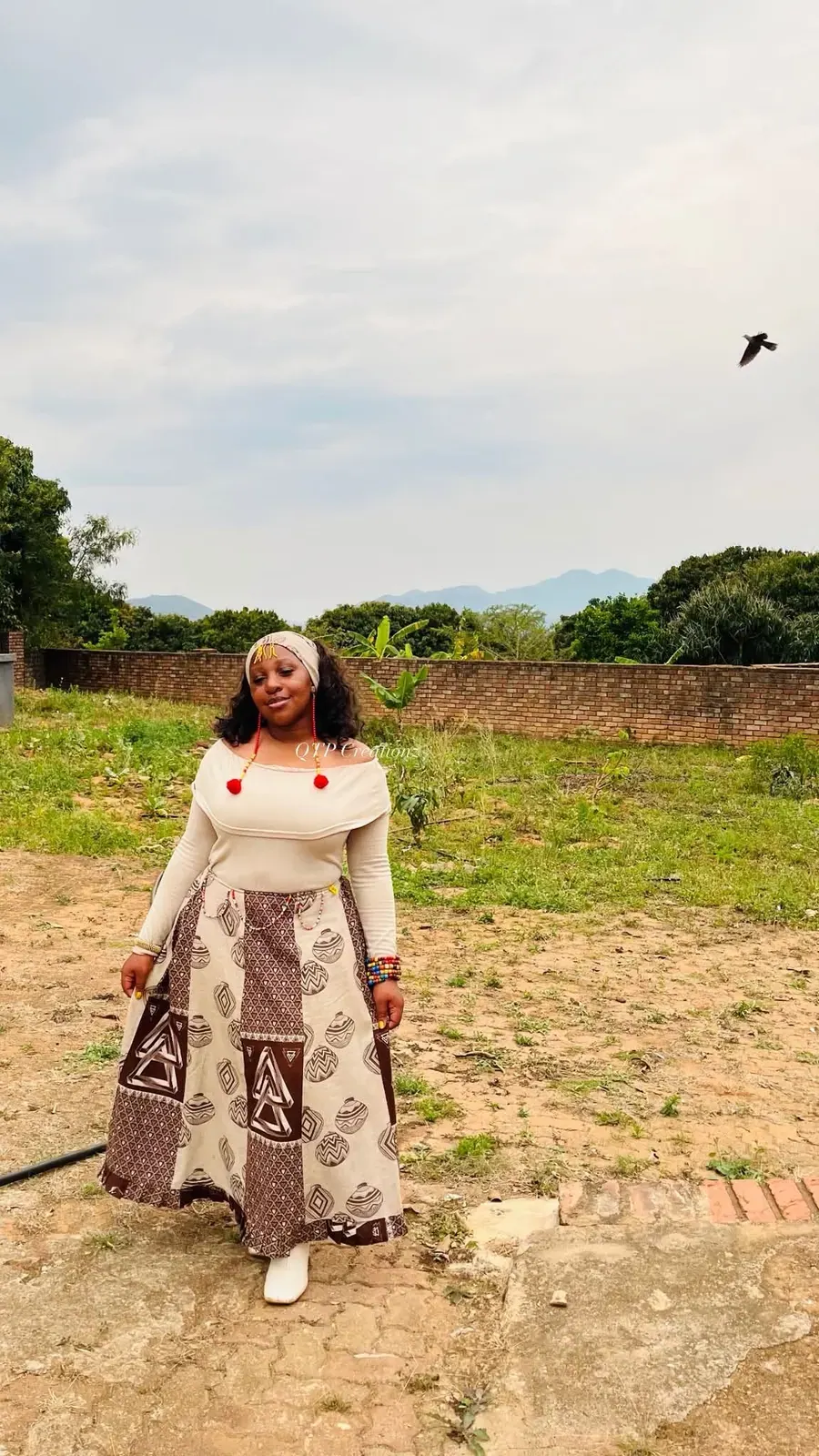 A woman wearing a handmade outfit outdoors