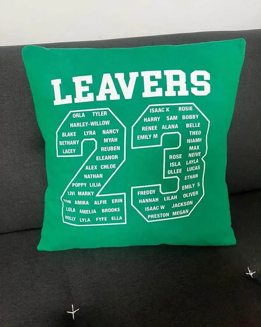 A green leavers 23 cushion with names