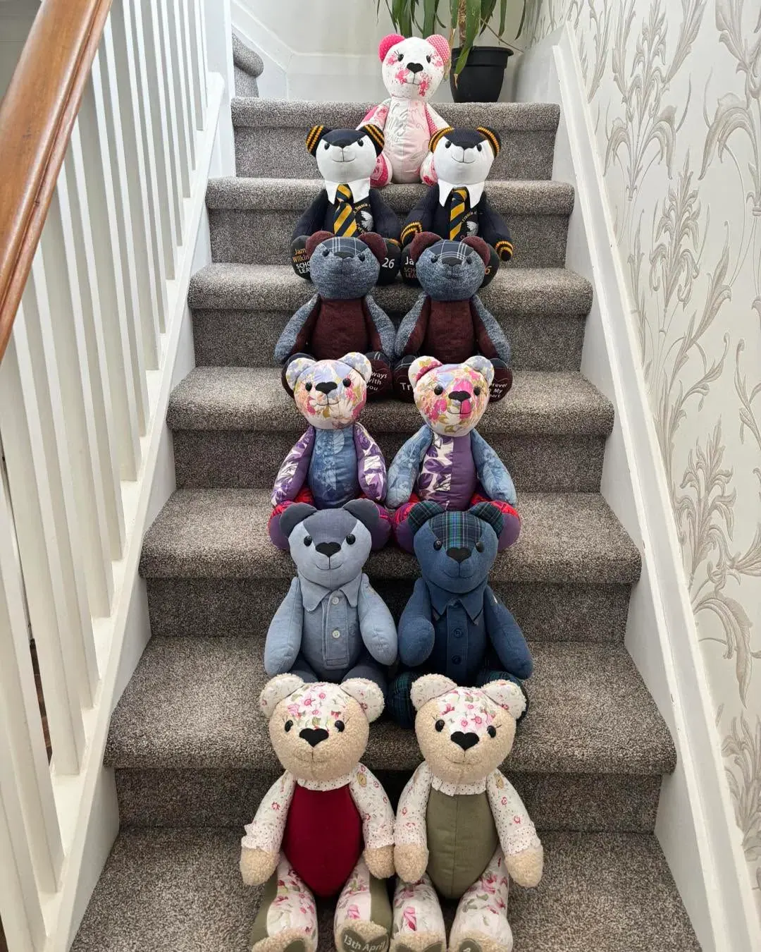 A row of handmade memory bears on a staircase