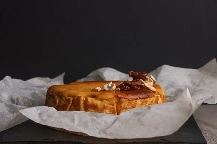A baked pecan cheesecake on baking paper