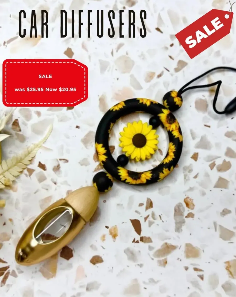 A sunflower beaded keyring on a decorated surface