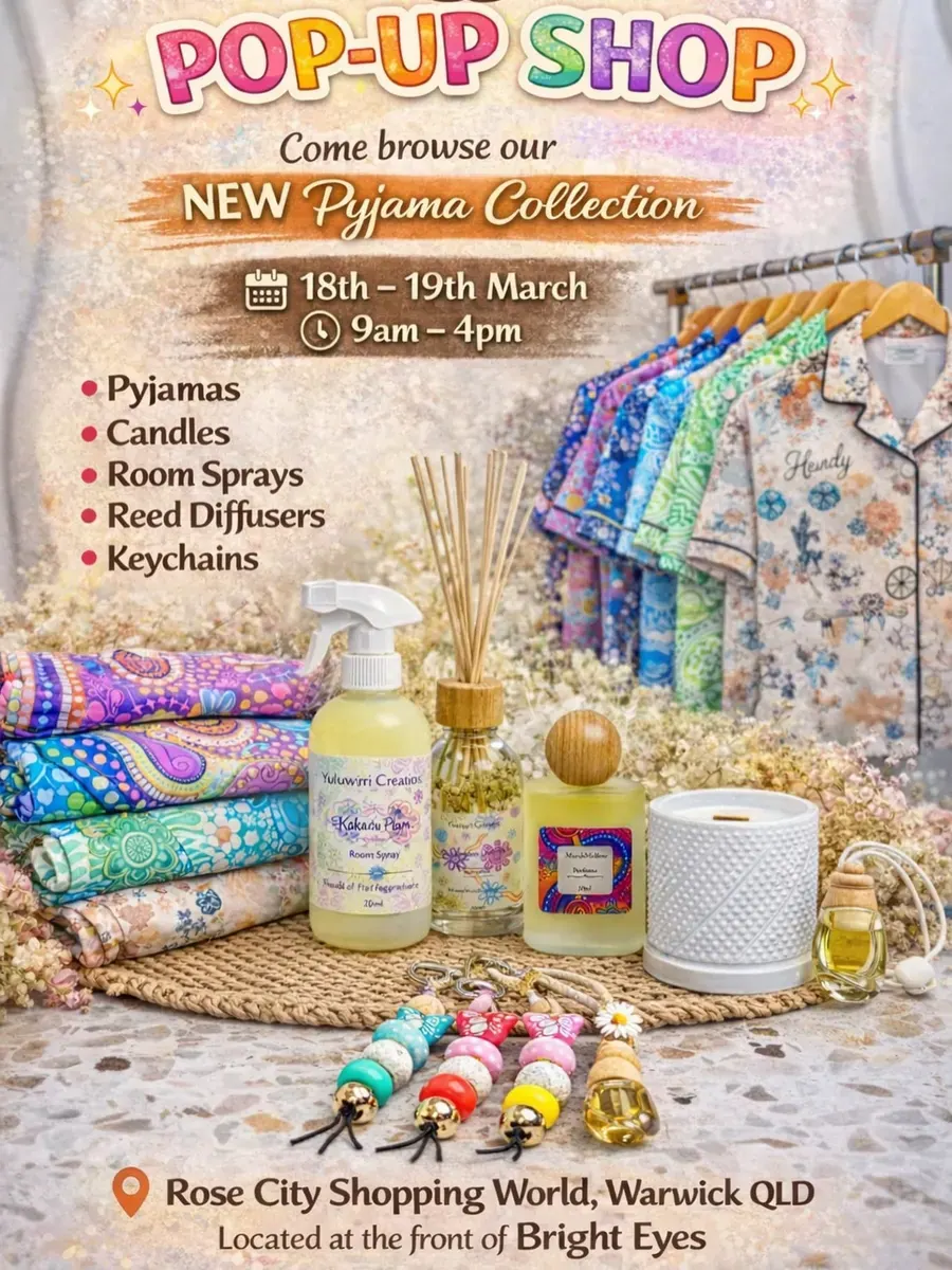 A table with pyjamas, candles and fragrance products